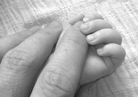 A small hand and a big hand
